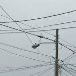 gray electric post with light