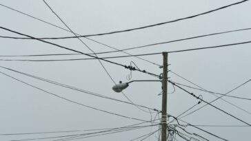 gray electric post with light