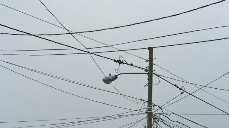 gray electric post with light